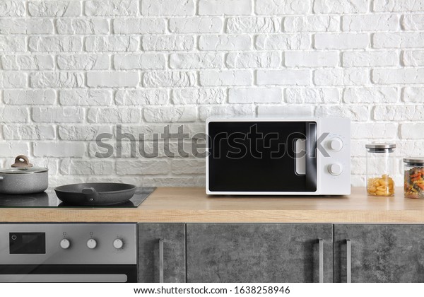 Modern microwave oven in\
kitchen