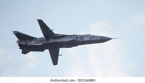 Modern Military Fighter Of The Latest Generation With A Variable Swept Wing And A Jet Engine Against The Sky. Close-up.