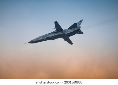 Modern Military Fighter Of The Latest Generation With A Variable Swept Wing And A Jet Engine Against The Sky. Close-up.