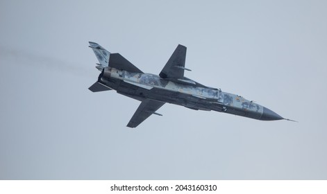 Modern Military Fighter Of The Latest Generation With A Variable Swept Wing And A Jet Engine Against The Sky. Close-up.