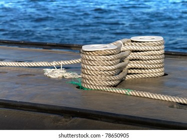 Modern military submarine fragment:careful bundle of rope on the mooring bollard