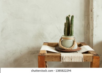 Modern Minimal Home Interior Design Boho Scandinavian Cactus In Pot Decoration On Wooden Twine Desk Near Concrete Wall. Brown Beige  Warm Pastel Colors