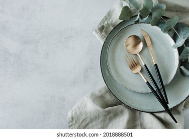 Modern minimal table place setting neutral green color on gray concrete background top view. Space for text .  Modern kitchen.Scandinavian style tableware.Business food brand template. - Shutterstock ID 2018888501