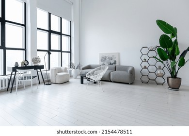 modern minimalistic interior design of light bright monochrome room with black and white furniture, clean white walls and huge windows