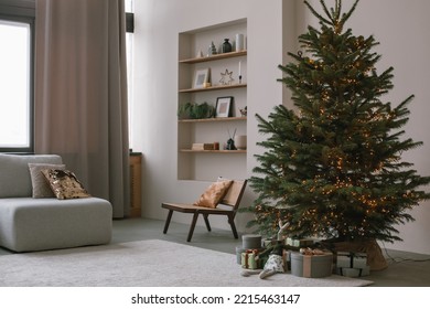 Modern minimalistic living room with beautiful huge Christmas tree and wrapped gifts. Scandinavian interior design. Winter holidays celebration. - Powered by Shutterstock