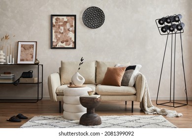 Modern minimalistic living room interior design with sofa, console, mock up poster frame, lamp and stylish personal accessories. Copy space. Template.