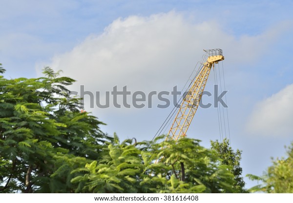 Modern mobile\
crane in the jungle (Select\
focus)\

