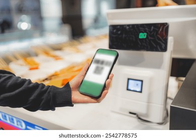 Modern Mobile Payment Technology at a Food Stall   - Powered by Shutterstock