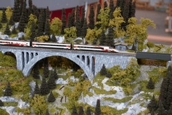 Modern Model Train On A Miniature Model Railway Bridge