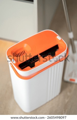 Modern mop with bucket with two sections. Mop with spin and rinse.