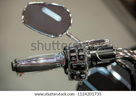 Modern motorcycle mirror and handlebar commands for cruise control, horn and lights