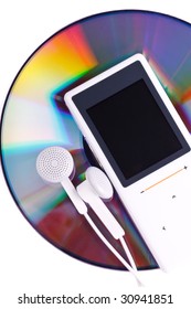 Modern MP3 player and CD disk on a white background. Close up.