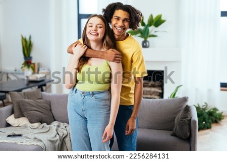 modern multiethnic unstereotyped couple lifestyle moments at home. Not stereotyped boyfriend and girlfriend living together. True love concepts