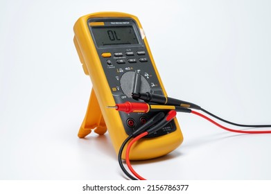 Modern multimeter with insulation test with different measurement and probes , isolated on white background. Electrical tool