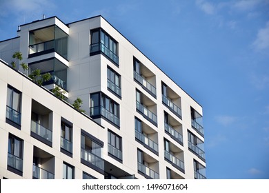Modern and new apartment building. Multistoried modern, new and stylish living block of flats. - Shutterstock ID 1496071604