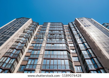 Modern and new apartment building. Multistoried, modern, new and stylish living block of flats. Real estate. New house. Newly built block of flats.