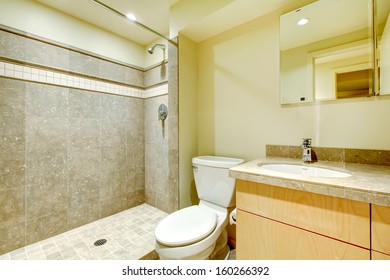 Modern New Bathroom Interior With Grey Tiles Shower.