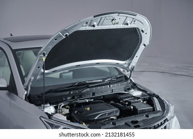 A Modern new car close-up of the engine, front top view, show all parts and open hood.  - Shutterstock ID 2132181455