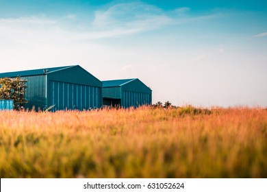 Modern New Company Warehouse Building, Farm Buildings By The Field, Outdoors Theme Concept Vintage Relaxing.