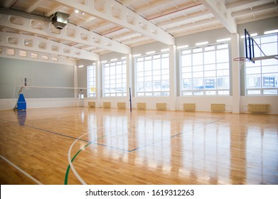 Modern New School Building. Empty School Gymnasium With Yellow Floor And Climbing Near Walls