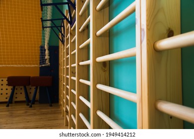 Modern New School Building. Empty School Gymnasium With Yellow Floor And Climbing Near Walls