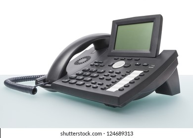 modern new telephone on desk with blank display