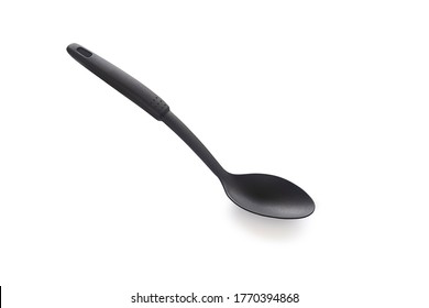 Modern non stick plastic ladle in black color for stir soup or scoop on white isolated background with clipping path. Perfect studio shot cookware and utensils concept for cooking food.