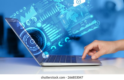 Modern notebook computer with future technology media symbols Stock Photo