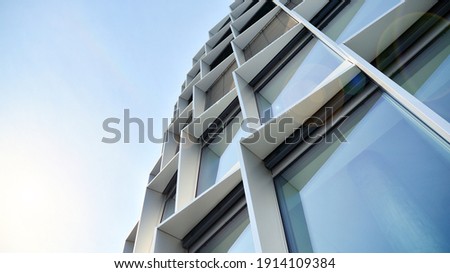 Modern office block with sunny beautiful sky. Bright outlook for business. Rising sun on the horizon.