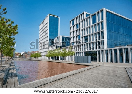 Modern office Building at Aarhus near the sea with lake in front during sunny day, Denmark
