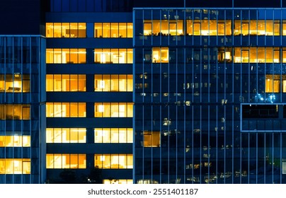 Modern office building facade at night - Powered by Shutterstock