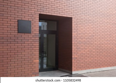 Modern Office Building, Glass Door And Black Plate. Mockup.