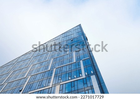 Modern office building glass facade. Skyscraper exterior. Architecture details.