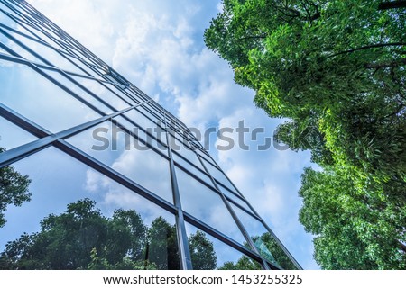 modern office building with green leaves
