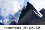 modern office building in the sky,Futuristic Skyscrapers Under Blue Sky with Reflecting Clouds