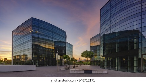 Modern office building in the sunset light - Shutterstock ID 648712171