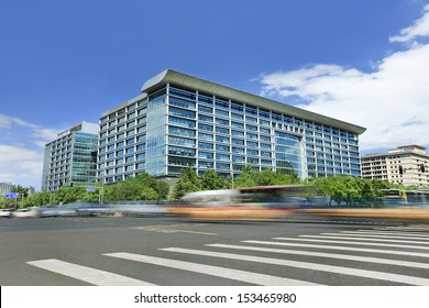 Modern Office Building With Traffic In Motion Blur