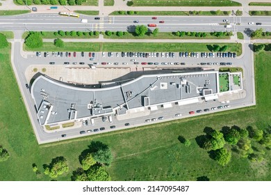 Modern Office Building In Urban Area. Parking Lot With Parked Cars. Aerial Top View At Sunny Day.