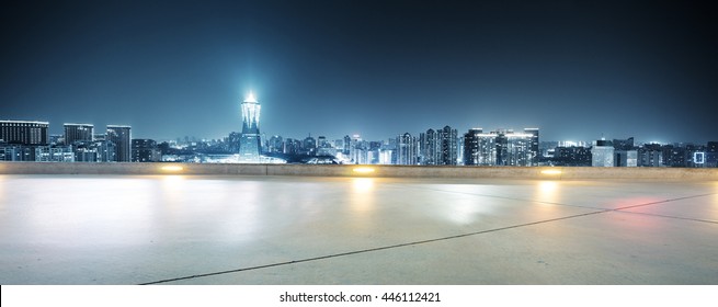modern office buildings in hangzhou west lake square at night on view from empty street - Shutterstock ID 446112421