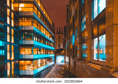 Modern Office Buildings In The Night With A Small Church In The Middle At London