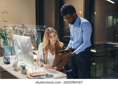 Modern Office Collaboration With Data Visualization Technology During Evening Work Hours Fostering Innovation