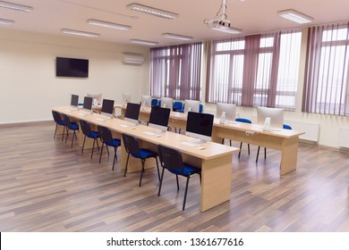 Modern Office With Computers On Desks. Empty Computer Room In College. Interior Of Classroom With Computers. Concept Of Corporate Working Space.