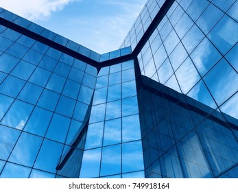 Modern office Corporate business glass building and blue sky
