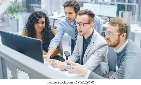 In Modern Office: Diverse Team of Businessmen and Businesswoman Work on Computer, Having Discussion, Successfully Finding Problem, Applaud and Cheerfully Celebrate. Happy and Motivated Businesspeople - Shutterstock ID 1786129490