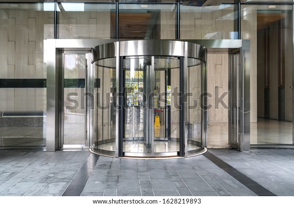 Modern office\
entrance glass revolving\
door