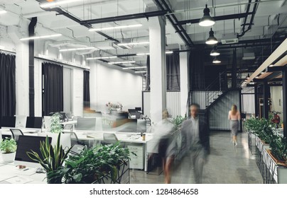 Modern Office Interior With Blurred Business People In Motion 