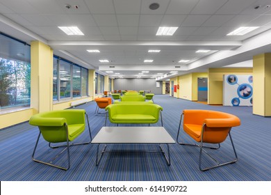 Modern Office Interior With Colorful Lounge Area, With Green And Orange Furniture