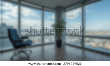 A modern office interior featuring a comfortable chair, large windows, and panoramic views of the city skyline. The space is bright and airy, with natural light illuminating the room.