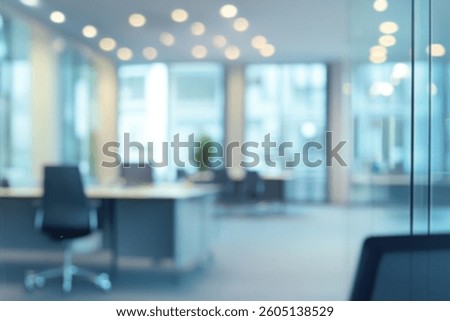 Modern office interior with a spacious layout, featuring large windows and contemporary furniture.