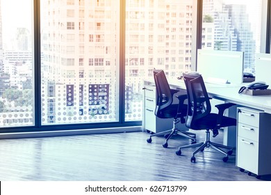 Modern Office With Open Space To Work Thought The Window And Background City.